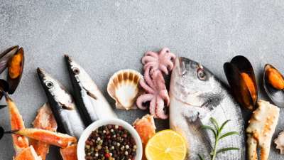 What are the health risks associated with high seafood consumption?