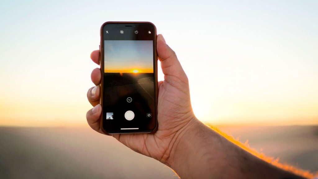 What precautions should be taken while photographing a solar eclipse with a smartphone?