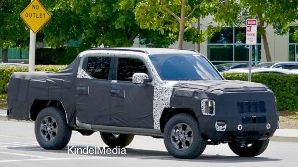 What unique collaboration influenced the design of Kia's Tasman pickup truck camouflage wrap?