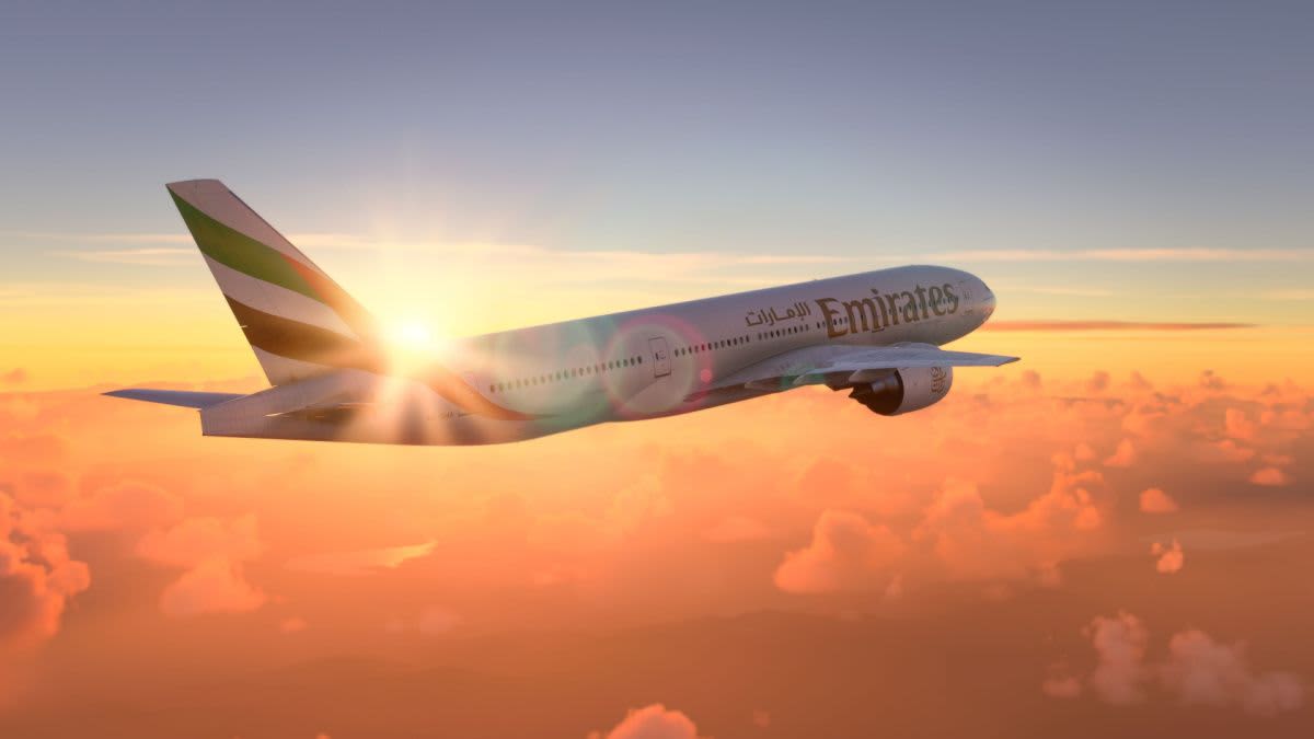 How can members earn Skyward Miles besides flying with Emirates?