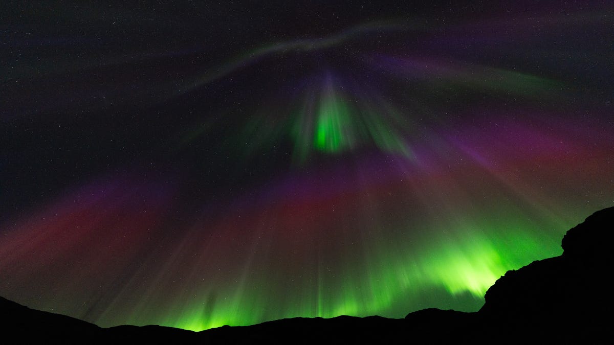 How can phone cameras help capture the northern lights even if they are not visible to naked eyes?